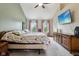 Primary bedroom with a vaulted ceiling, tv and bright natural light at 4434 W Windsong Ct, New Palestine, IN 46163