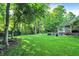 Expansive backyard featuring a lush lawn and mature trees, perfect for outdoor enjoyment at 4530 Chase Oak Ct, Zionsville, IN 46077