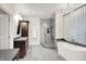 Elegant bathroom with a glass-enclosed shower, soaking tub, and stylish fixtures at 4530 Chase Oak Ct, Zionsville, IN 46077