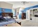 Spacious bedroom features a built-in bookcase and blue accent wall at 4530 Chase Oak Ct, Zionsville, IN 46077