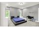 Modern bedroom features a platform bed and a bright window at 4530 Chase Oak Ct, Zionsville, IN 46077