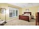 Cozy bedroom with a ceiling fan and a large window that brings in plenty of natural light at 4530 Chase Oak Ct, Zionsville, IN 46077