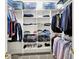 Organized closet with built-in shelving, hanging rods, and storage for shoes and clothing at 4530 Chase Oak Ct, Zionsville, IN 46077