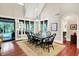 Elegant dining room with hardwood floors, large windows, and access to the outdoors at 4530 Chase Oak Ct, Zionsville, IN 46077
