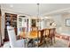 Spacious dining room with a large wooden table, chandelier, and views to the living room at 4530 Chase Oak Ct, Zionsville, IN 46077