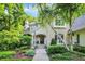 Charming two-story home with stone and stucco accents, landscaped garden, and welcoming front porch at 4530 Chase Oak Ct, Zionsville, IN 46077