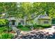 Beautiful stone and stucco home with a well-manicured lawn and lush flowerbeds at 4530 Chase Oak Ct, Zionsville, IN 46077