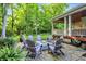 Stone patio area with a fire pit surrounded by comfortable Adirondack-style chairs at 4530 Chase Oak Ct, Zionsville, IN 46077