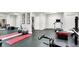 Spacious home gym with ample room for fitness equipment and a mirrored wall to track workout progress at 4530 Chase Oak Ct, Zionsville, IN 46077