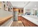 Well-equipped kitchen with stainless steel appliances, custom cabinetry, and a breakfast bar at 4530 Chase Oak Ct, Zionsville, IN 46077