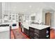 Spacious kitchen with white cabinets, large island, and stainless steel appliances at 4530 Chase Oak Ct, Zionsville, IN 46077