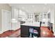 Kitchen features white cabinets, stainless appliances, and large island with seating at 4530 Chase Oak Ct, Zionsville, IN 46077