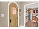Charming doorway to kitchen with stainless steel appliances and custom wood cabinetry at 4530 Chase Oak Ct, Zionsville, IN 46077