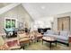 Bright, open-plan living room featuring a dining area, kitchen, and comfortable seating at 4530 Chase Oak Ct, Zionsville, IN 46077