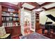 Elegant office with hardwood floors, custom built-ins, and view to another room at 4530 Chase Oak Ct, Zionsville, IN 46077
