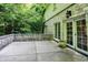 A stone patio is flanked by double doors and a low stone wall at 4530 Chase Oak Ct, Zionsville, IN 46077