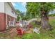 Inviting backyard with a fire pit, deck, and mature trees, perfect for relaxation at 4840 E 77Th St, Indianapolis, IN 46250
