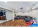 Spacious finished basement with a comfortable couch and adjacent laundry room at 4840 E 77Th St, Indianapolis, IN 46250