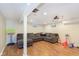Cozy basement featuring a large sectional, hardwood floor, and toys at 4840 E 77Th St, Indianapolis, IN 46250