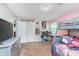 Inviting bedroom showcasing a bunk bed, white closet doors and carpet, and a mounted TV at 4840 E 77Th St, Indianapolis, IN 46250