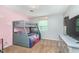 Charming bedroom with gray bunk beds and a neutral colored carpet and walls, and a chest of drawers at 4840 E 77Th St, Indianapolis, IN 46250