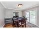 Dining room with wood table and chairs and sliding door to outdoor deck at 4840 E 77Th St, Indianapolis, IN 46250