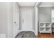 Inviting entryway showcasing slate flooring, a white front door, and modern storage shelves at 4840 E 77Th St, Indianapolis, IN 46250