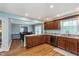 Open kitchen with breakfast bar overlooking the dining room at 4840 E 77Th St, Indianapolis, IN 46250