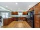 Updated kitchen with stainless steel appliances, granite countertops, and wooden cabinets at 4840 E 77Th St, Indianapolis, IN 46250