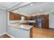 Spacious kitchen featuring granite countertops, stainless steel appliances, and wooden cabinets at 4840 E 77Th St, Indianapolis, IN 46250