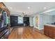 Spacious living room with desk and cabinets, with view to kitchen and dining at 4840 E 77Th St, Indianapolis, IN 46250