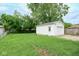 Well-maintained backyard with lush green grass and a detached one-car garage at 4922 Brookville Rd, Indianapolis, IN 46201