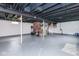 The unfinished basement has painted floors, exposed ceiling, and support beams at 4922 Brookville Rd, Indianapolis, IN 46201