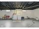 The unfinished basement features white walls, painted floors, and laundry machines at 4922 Brookville Rd, Indianapolis, IN 46201