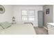 This bedroom has two windows and a gray storage cabinet at 4922 Brookville Rd, Indianapolis, IN 46201