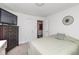 This bedroom has a mounted television, closet, and doorway at 4922 Brookville Rd, Indianapolis, IN 46201