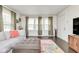 Spacious living room with ample natural light, comfortable seating, and stylish decor at 4922 Brookville Rd, Indianapolis, IN 46201