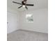 Bright bedroom featuring carpet, closet, and natural light from a window at 5982 Melbourne Rd, Indianapolis, IN 46228