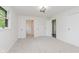 Bright bedroom with carpet, natural light, closet, and bathroom access at 5982 Melbourne Rd, Indianapolis, IN 46228