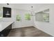 Bright dining area with modern chandelier and backyard views at 5982 Melbourne Rd, Indianapolis, IN 46228