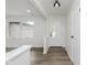 Bright entryway with wood floors, fresh paint and views to the front yard at 5982 Melbourne Rd, Indianapolis, IN 46228