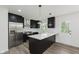 Modern kitchen features stainless steel appliances and black cabinets at 5982 Melbourne Rd, Indianapolis, IN 46228