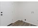 Bright laundry room with hookups and modern flooring at 5982 Melbourne Rd, Indianapolis, IN 46228