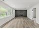 Spacious living room with a brick fireplace, and natural light at 5982 Melbourne Rd, Indianapolis, IN 46228