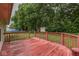 Spacious back deck provides ample room for outdoor dining and relaxation amidst a lush, green landscape at 6010 Rocky River Dr, Indianapolis, IN 46221