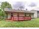 A charming home featuring a spacious backyard deck, perfect for outdoor relaxation and entertaining at 6010 Rocky River Dr, Indianapolis, IN 46221