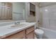 Bathroom featuring a sink, toilet, mirror, and shower with tub at 6010 Rocky River Dr, Indianapolis, IN 46221