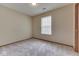 Neutral bedroom featuring carpeted floors and a window for natural light at 6010 Rocky River Dr, Indianapolis, IN 46221