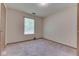 Neutral bedroom featuring carpeted floors and a window for natural light at 6010 Rocky River Dr, Indianapolis, IN 46221