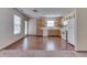 Well-lit kitchen with wooden cabinets, white appliances, and laminate flooring, offering a functional cooking space at 6010 Rocky River Dr, Indianapolis, IN 46221
